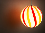 Candy Murano glass sphere pendant lamp "Una Festa!" red and yellow soft swirl D30