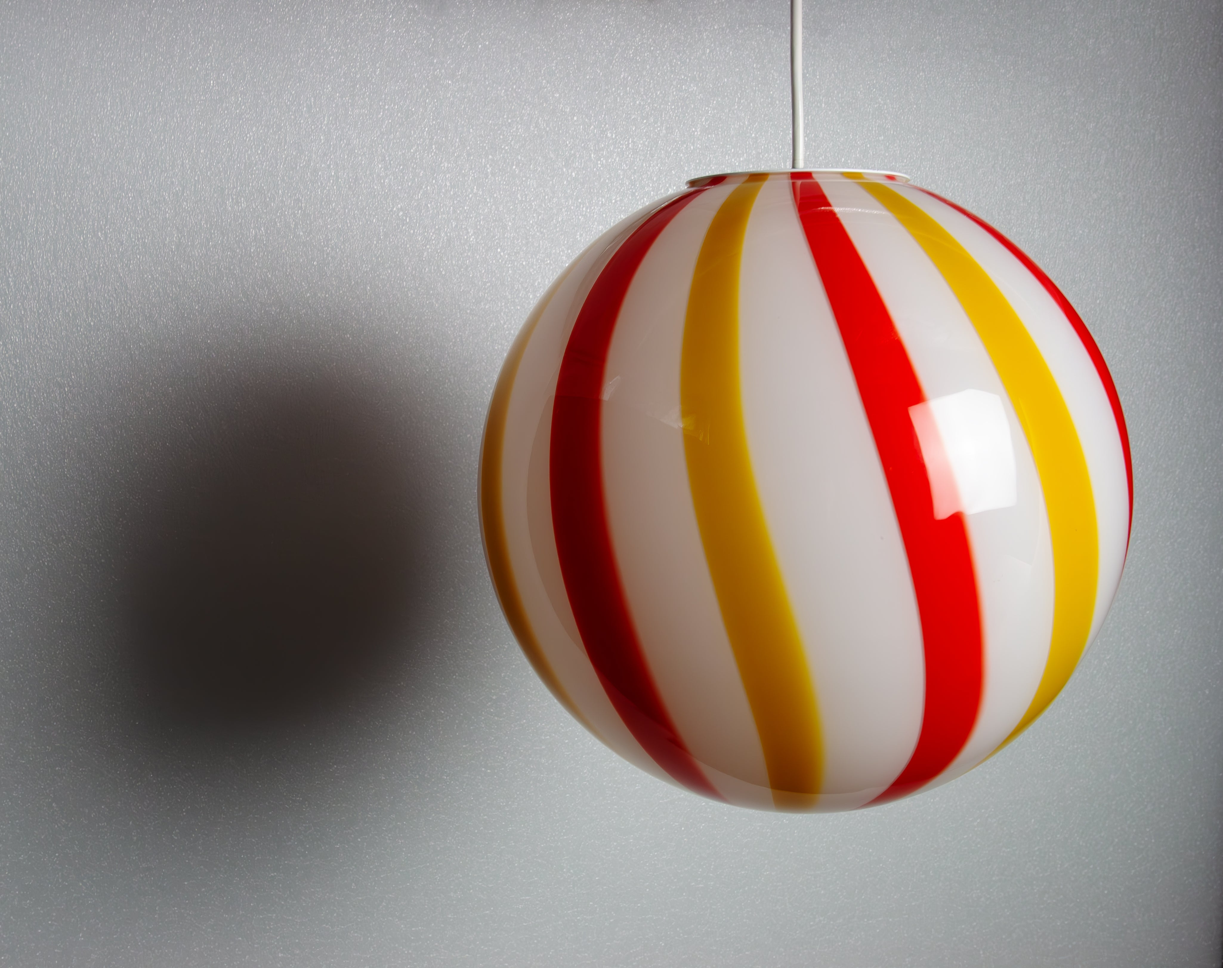 Candy Murano glass sphere pendant lamp "Una Festa!" red and yellow soft swirl D30